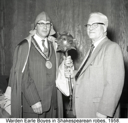 Black and white photograph of Warden Earle Boyes in Shakespearean robes, 1958