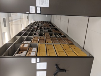 Image of a shelf in the Stratford-Perth Archives Collections Room